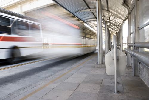 Photo of a train speeding by, blurry.