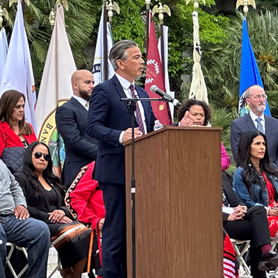Attorney General Bonta speaking in front of a podium
