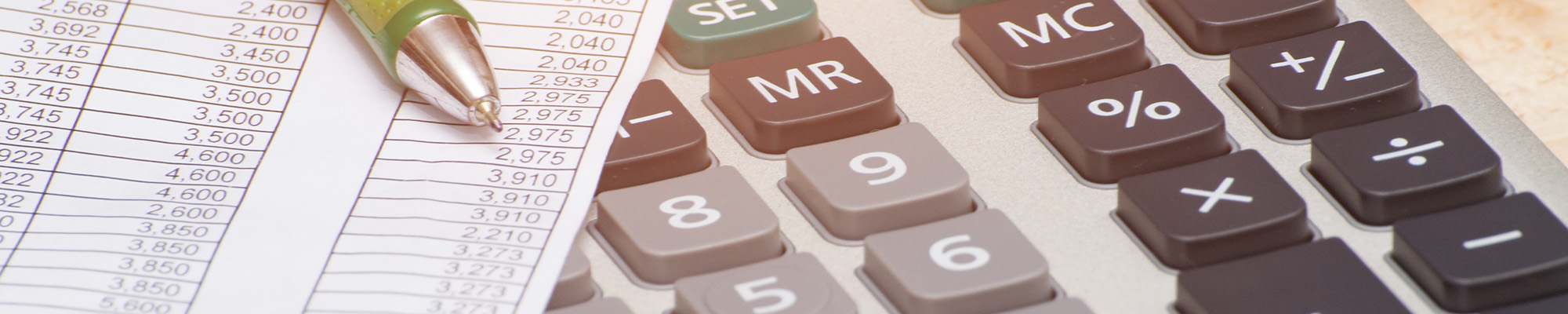 Stock photo of calculator, pen, and spreadsheet